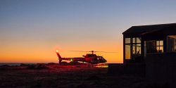 REACH waits for patient at LZ on bluff trail