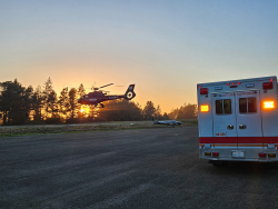 REACH departs with a patient at sunset